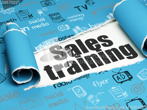 Image of Marketing concept: black text Sales Training under the piece of  torn paper