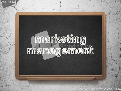 Image of Advertising concept: Marketing Management on chalkboard background