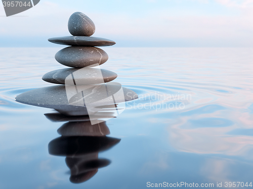 Image of Balanced Zen stones in water 