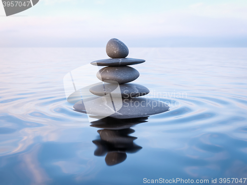 Image of Balanced Zen stones in water 