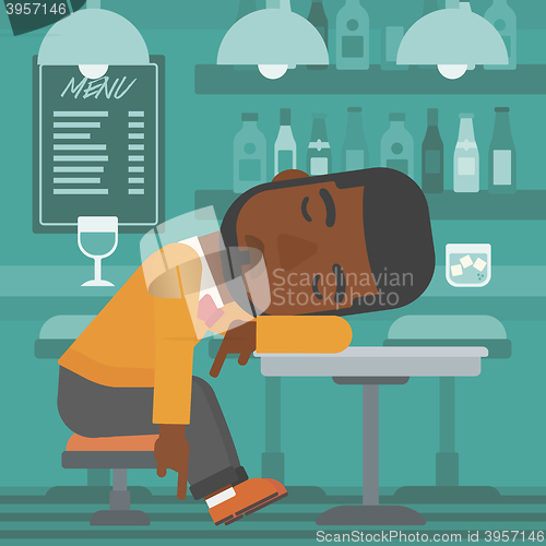 Image of Man sleeping in bar. 