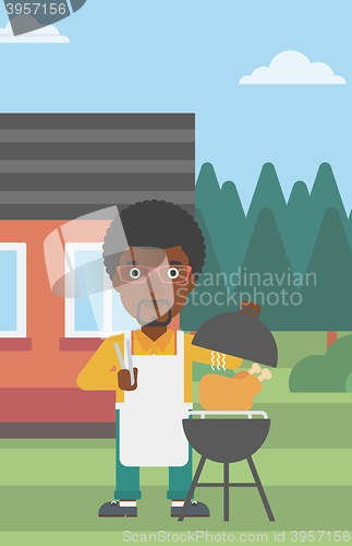 Image of Man preparing barbecue.