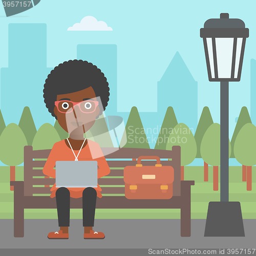 Image of Woman working on laptop.