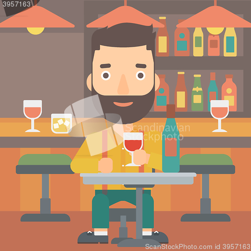Image of Man sitting at bar.