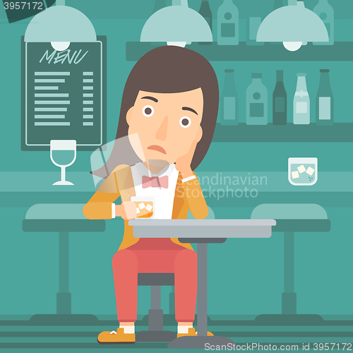 Image of Woman sitting at bar.