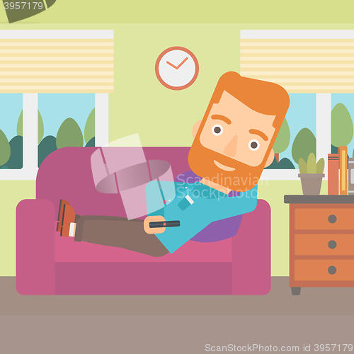 Image of Man lying on sofa.