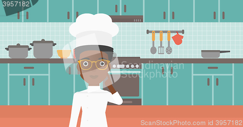 Image of Chef pointing forefinger up.