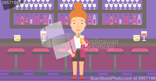 Image of Woman holding glass of juice.