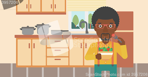 Image of Man eating salad.