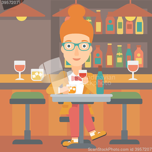 Image of Woman sitting at bar.