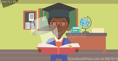 Image of Man in graduation cap holding book.