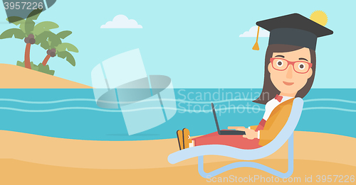 Image of Graduate lying on chaise lounge with laptop.