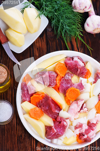 Image of raw meat with vegetables