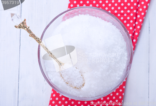 Image of white sugar in glass bank