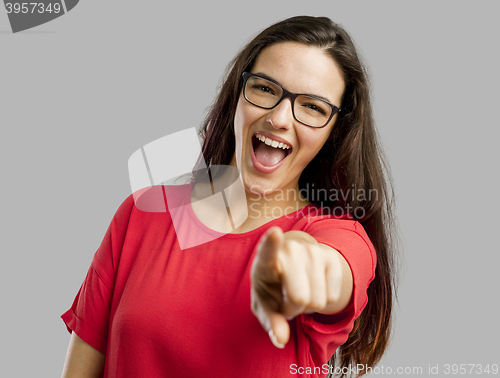 Image of Happy woman pointing to the camera