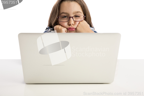 Image of Little girl working with a laptop