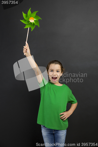 Image of Little girl holding a windmill