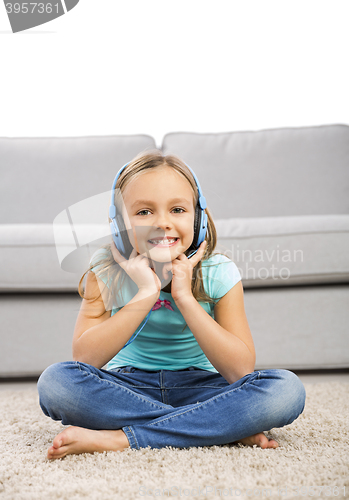 Image of Cute girl listen music