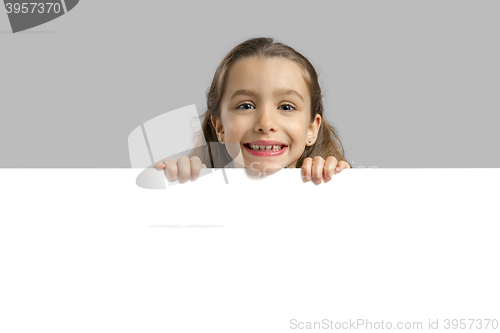 Image of Cute girl holding a blankboard