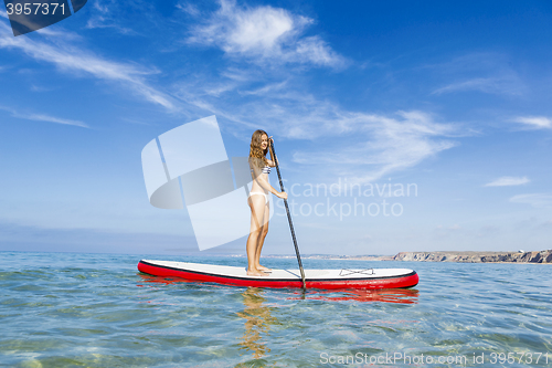 Image of Woman practicing paddle