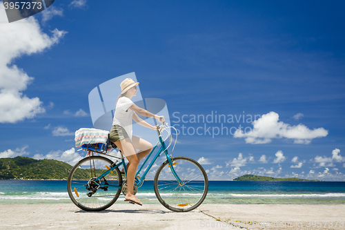 Image of Woman ride along The Beach