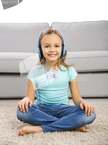 Image of Cute girl listen music