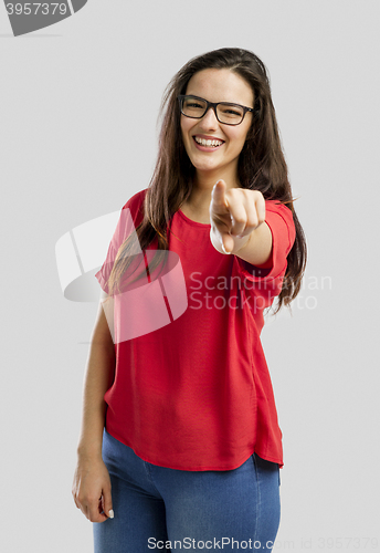 Image of Happy woman pointing to the camera