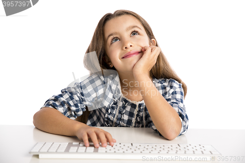 Image of Little girl working with a computer