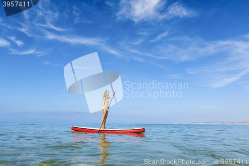 Image of Woman practicing paddle