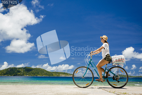 Image of Woman ride along The Beach