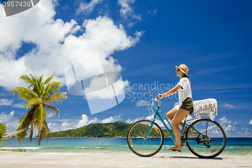 Image of Woman ride along The Beach