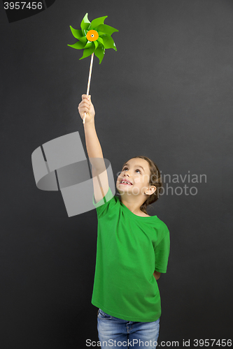 Image of Little girl holding a windmill