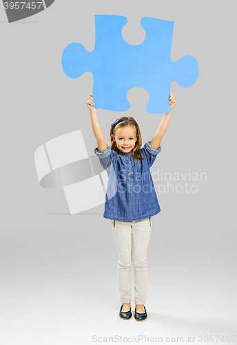 Image of Girl holding a puzzle