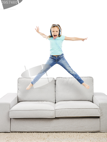 Image of Happy girl listen music