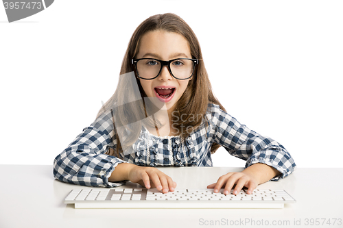 Image of Little girl working with a computer