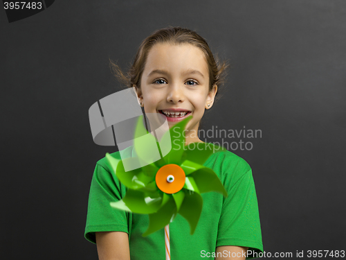 Image of Little girl holding a windmill