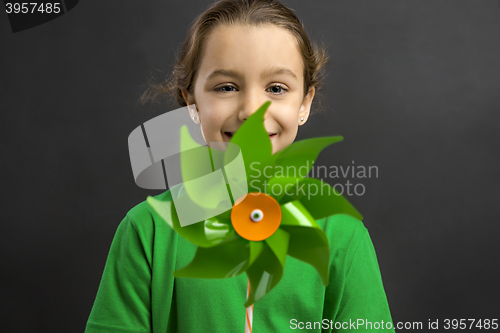 Image of Little girl holding a windmill