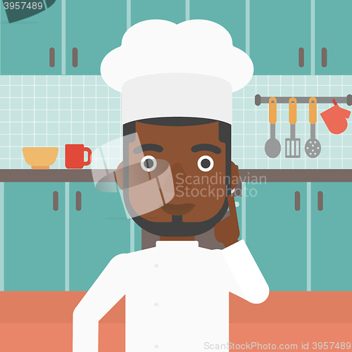 Image of Chef pointing forefinger up.