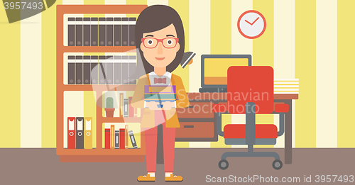 Image of Woman holding pile of books.