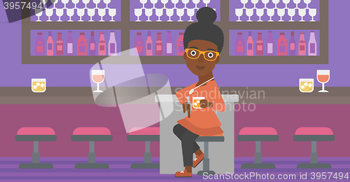 Image of Woman sitting at bar.