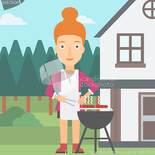 Image of Woman preparing barbecue.