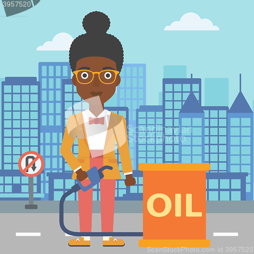 Image of Woman with oil can and filling nozzle.