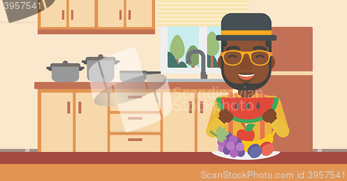 Image of Man eating watermelon.