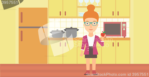 Image of Woman holding apple.