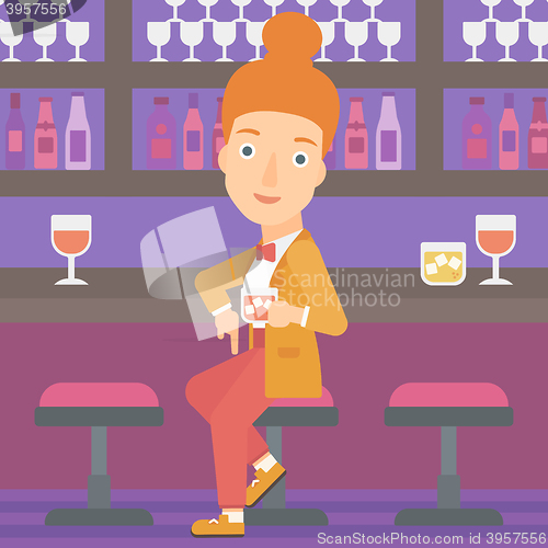 Image of Woman sitting at bar.