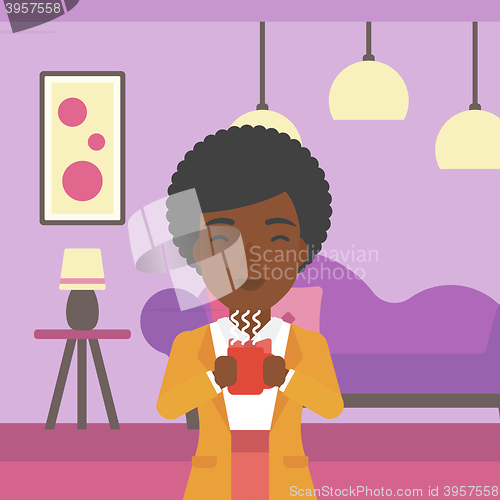 Image of Woman sitting with cup of coffee.