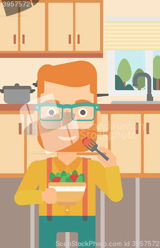 Image of Man eating salad.