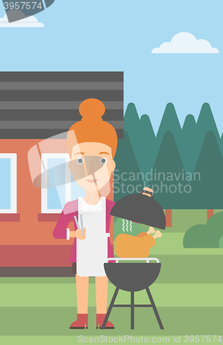 Image of Woman preparing barbecue.