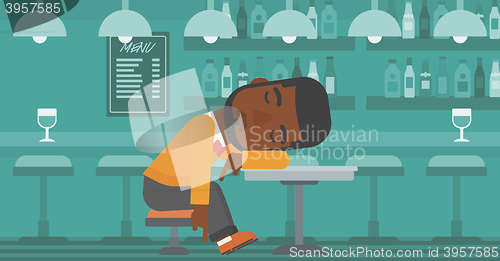 Image of Man sleeping in bar. 