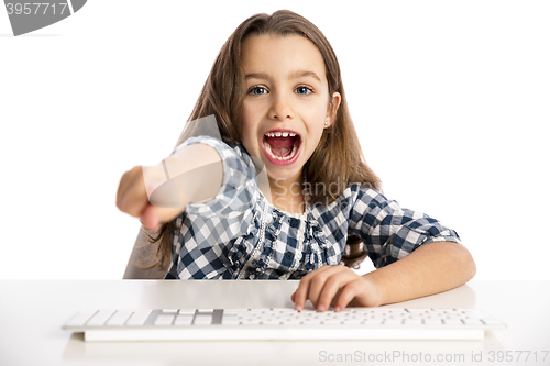 Image of Little girl working with a computer